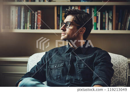 Your thoughts govern your future in business. Shot of a handsome young businessman looking thoughtful while sitting on a couch in his office at home. Your thoughts govern your future in business. Shot of a handsome young businessman looking thoughtful while sitting on a couch in his office at home. 119213049