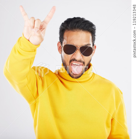 Man, horns and hand with sunglasses, studio portrait and rock icon for gesture, clothes and white background. Young guy, model and devil fingers for attitude, fashion and sign with emoji for culture 119213348