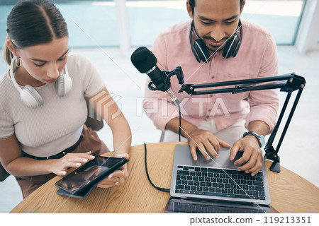 Radio presenter, technology and teamwork for podcast, content creation and planning with laptop or tablet. Talk show, man and woman in studio with headphones for collaboration with broadcast or media 119213351