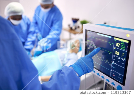 Monitor, surgery and doctors team doing heart operation for emergency organ treatment or healing anatomy in hospital. Rescue, medical and professional surgeon or healthcare teamwork collaboration 119213367