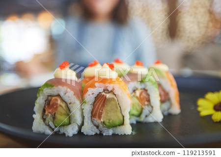 Closeup, restaurant plate and sushi for lunch, eating seafood and Chinese food on bokeh. Zoom, health and a hungry person with a luxury fine dining dish of fish, Asian cuisine and dinner at a cafe Closeup, restaurant plate and sushi for lunch, eating seafood and Chinese food on bokeh. Zoom, health and a hungry person with a luxury fine dining dish of fish, Asian cuisine and dinner at a cafe 119213591