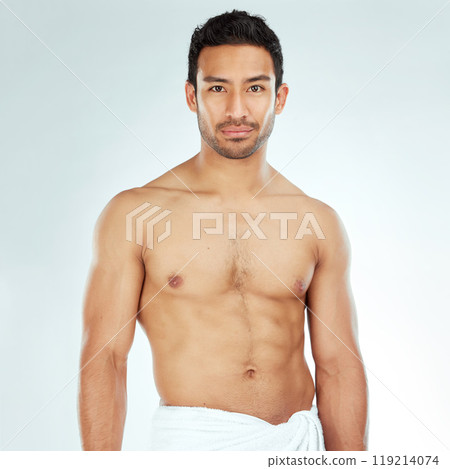 Body, chest and portrait of asian man in a towel in studio for cleaning, hygiene and care on white background. Face, confidence muscular Japanese model with glowing skin grooming results after shower 119214074