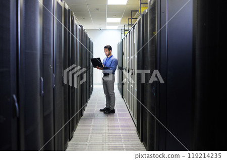 Server room, laptop or man typing for cybersecurity glitch, machine or to search online for servers system. IT support, data center or engineer fixing network for information technology solution Server room, laptop or man typing for cybersecurity glitch, machine or to search online for servers system. IT support, data center or engineer fixing network for information technology solution 119214235