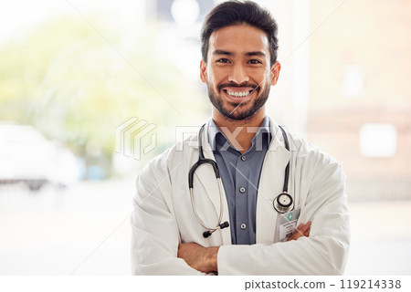 Smile, portrait and asian man doctor with arms crossed in hospital for consulting, exam and help on blurred background. Happy, face and guy healthcare expert proud of service while working at clinic Smile, portrait and asian man doctor with arms crossed in hospital for consulting, exam and help on blurred background. Happy, face and guy healthcare expert proud of service while working at clinic 119214338
