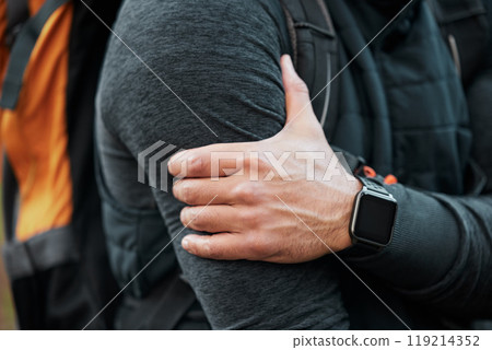 Arm pain, injury and person hand closeup with fitness, workout and travel accident from hike. Athlete, shoulder bruise and fail from trekking in the woods on a trail with muscle strain and backpack 119214352
