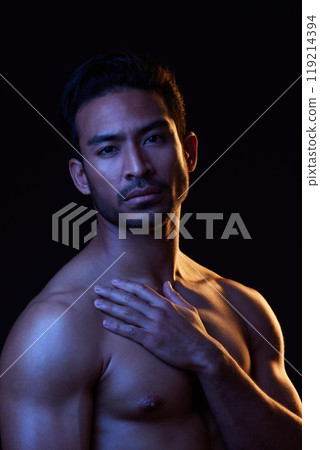 Topless, dark portrait and sexy man on black background in fitness inspiration, beauty aesthetic or bodybuilder fantasy. Healthy, strong body and male model with muscle, studio and neon lighting Topless, dark portrait and sexy man on black background in fitness inspiration, beauty aesthetic or bodybuilder fantasy. Healthy, strong body and male model with muscle, studio and neon lighting 119214394