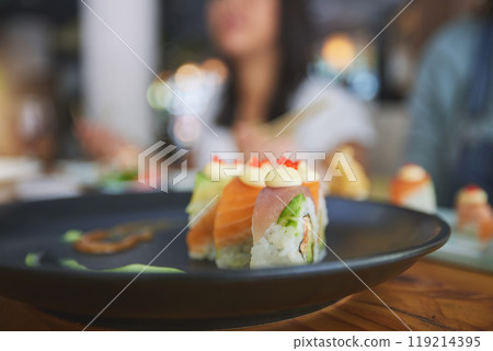 Restaurant, food and closeup of sushi on a plate for luxury, healthy and authentic Asian cuisine. Platter, fine dining and zoom of a Japanese meal for lunch, dinner or supper at a traditional cafe. Restaurant, food and closeup of sushi on a plate for luxury, healthy and authentic Asian cuisine. Platter, fine dining and zoom of a Japanese meal for lunch, dinner or supper at a traditional cafe. 119214395