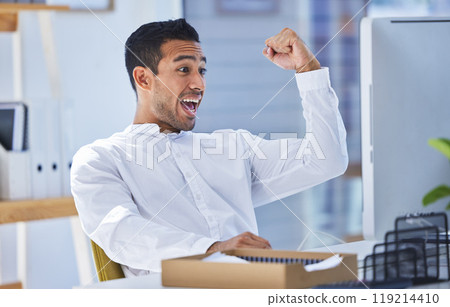 Wow, computer and businessman with winner fist in office celebration for stock market, deal or investment growth. Yes, excited and male accountant with good news, report or review, target or feedback 119214410