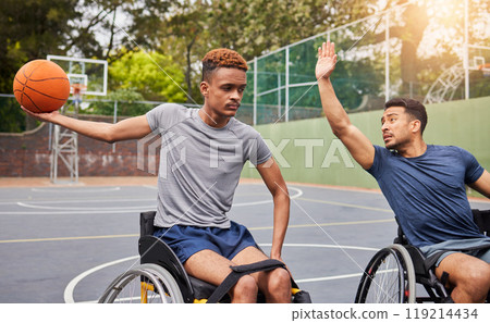 Sports, basketball and men in wheelchair for training, exercise and workout on outdoor court. Fitness, team and male people with a disability with ball playing for competition, practice and games 119214434