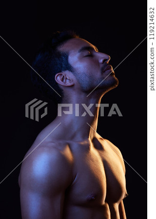 Topless, dark and sexy man in studio in fitness inspiration, beauty aesthetic or sensual fantasy. Erotic art, sexual body and seductive male model with muscle, black background and neon blue lighting 119214632