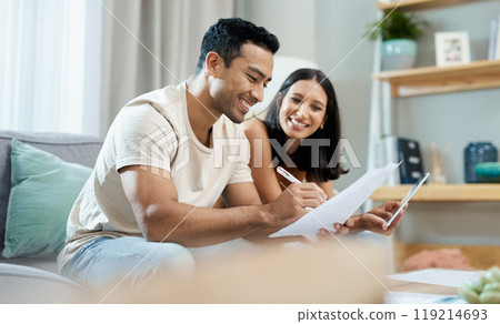 Happy couple, documents and budget planning on sofa in finance, expenses or bills together at home. Man and woman smile with paperwork in living room for loan, financial plan or insurance at house 119214693