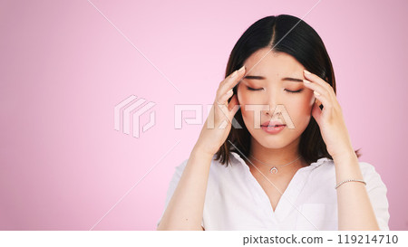 Asian woman, headache and stress in anxiety, burnout or tired against a pink studio background. Frustrated, upset or unhappy female person with migraine, injury or mental health pain on mockup space Asian woman, headache and stress in anxiety, burnout or tired against a pink studio background. Frustrated, upset or unhappy female person with migraine, injury or mental health pain on mockup space 119214710