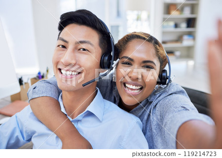 Selfie, happy and friends in a call center for customer service, support or advice with a smile together. Portrait, diversity or crm business with a man and woman consultant in the workplace Selfie, happy and friends in a call center for customer service, support or advice with a smile together. Portrait, diversity or crm business with a man and woman consultant in the workplace 119214723
