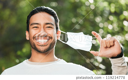Man, face mask and forest with smile, portrait and freedom for wellness, health and breathing in sunshine. Asian guy, covid ppe and excited for medical protection, immune system and outdoor in woods 119214778