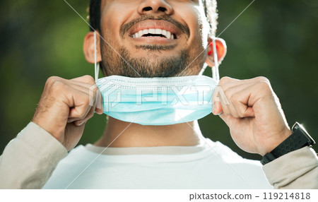 Mouth, mask and remove with a man breathing fresh air in nature, feeling happy at the end of restrictions. Covid, freedom and post lockdown with a person closeup in the forest, woods or wilderness 119214818