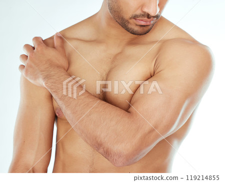 Body, closeup and man in studio for wellness, cleaning or grooming, routine and treatment against white background. Chest, cosmetics or male model hand touching soft, smooth or glowing skin results 119214855