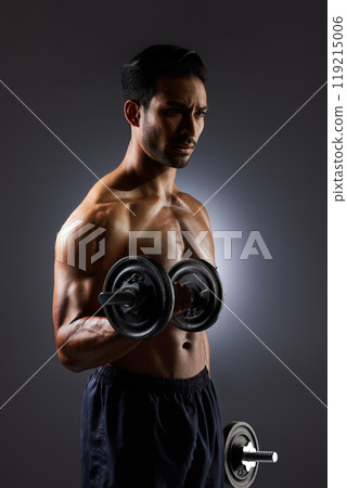 Thinking, dark and a man with weights on a black background for muscle, fitness and exercise. Sports, idea and an Asian bodybuilder or strong athlete doing weightlifting for training with power 119215006
