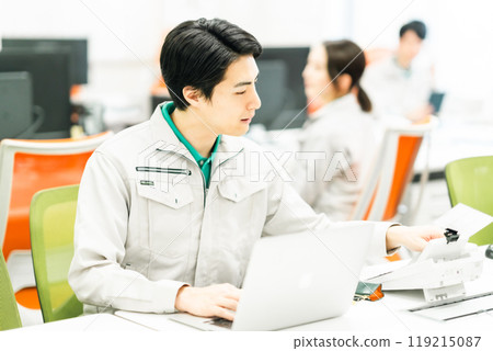 A team of engineers working in a design office A team of engineers working in a design office 119215087