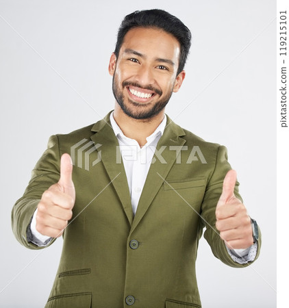 Happy asian man, portrait and thumbs up in thank you, winning or success against a white studio background. Businessman smile with like emoji, yes sign or OK in agreement, good job or approval 119215101