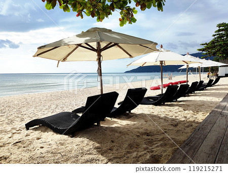 Sunbeds and umbrellas on the beach 119215271