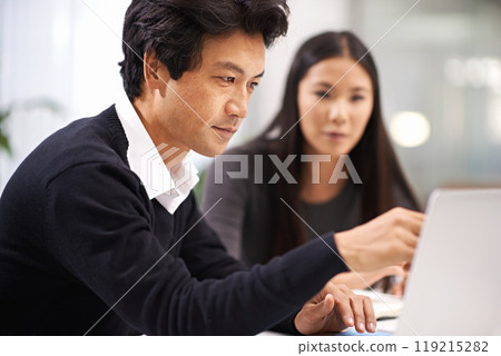 Business people, laptop and working in a office with Japanese staff and corporate team. Management, tech and internet research for company project at a startup with consulting firm with planning Business people, laptop and working in a office with Japanese staff and corporate team. Management, tech and internet research for company project at a startup with consulting firm with planning 119215282