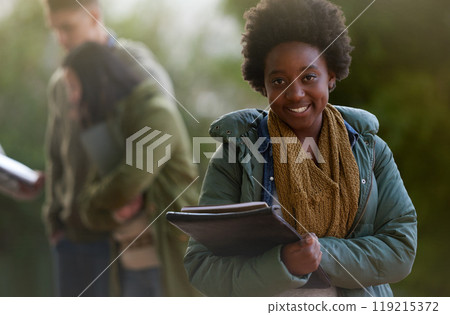 Student, black woman and smile with books on campus, education and learning with studying. Happy, scholarship and university for academic growth, textbook or notebook with knowledge in portrait 119215372