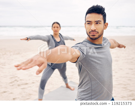 People, yoga and warrior pose on beach for fitness, exercise and holistic wellness, teamwork or workout outdoor. Couple of friends or instructor stretching with balance, health and pilates by ocean 119215373