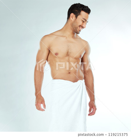 Shower, towel and happy fitness man in studio for wellness, hygiene or body care routine on white background. Cleaning, grooming or muscular Japanese male model with pamper, cosmetics or treatment 119215375
