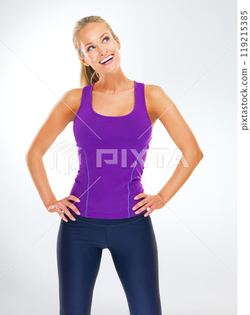 Fitness, thinking and happy woman in studio with sportswear, inspiration and healthy body. Exercise, wellness and girl on white background for workout ideas, smile and confidence with activewear 119215385