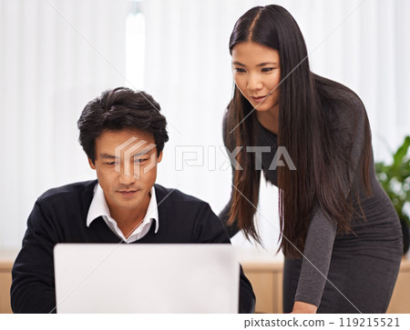Teamwork, mentor and help with laptop in office or businessman learning from support of woman. Feedback, advice and manager training asian man on computer in collaboration and reading online research 119215521