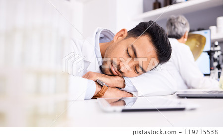 Asian man, scientist and sleeping on desk in laboratory, burnout or overworked in mental health. Tired male person, medical or healthcare worker asleep in lab rest, dreaming or fatigue at workplace Asian man, scientist and sleeping on desk in laboratory, burnout or overworked in mental health. Tired male person, medical or healthcare worker asleep in lab rest, dreaming or fatigue at workplace 119215538