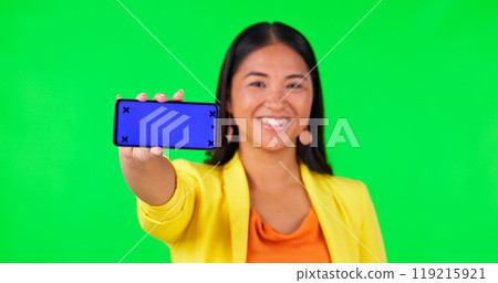 Portrait of woman, green screen and phone with mockup space or tracking markers on studio background. Media, mobile or happy asian lady showing product placement for news and how to steps for app 119215921