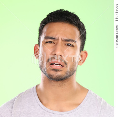 Question, why and confused portrait of man with doubt in studio on pastel green background and thinking. Stupid, faq and person problem solving with puzzle, challenge or conflict in mock up space 119215995