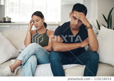 Divorce, stress or couple fight on sofa with headache, anxiety or frustrated by liar, fail or drama at home. Marriage, conflict or asian people argue in living room with fear, overthinking or mistake 119216018