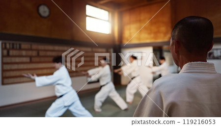 Japanese students, lesson or sensei in dojo to start aikido practice, discipline or teaching self defense. Black belt master, people learning combat or athletes in fighting class, training or sports Japanese students, lesson or sensei in dojo to start aikido practice, discipline or teaching self defense. Black belt master, people learning combat or athletes in fighting class, training or sports 119216053