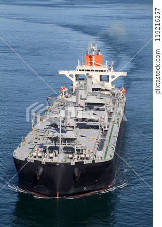 A large cargo ship approaching the Kurushima Kaikyo Bridge 119216257