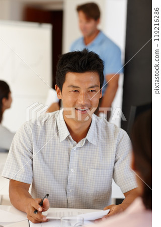 Meeting, recruitment or Asian man in job interview with documents in office talking in negotiation. Explain, manager or person speaking to hr for hiring opportunity in discussion with business people 119216286