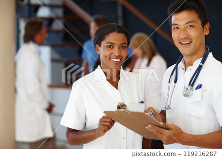 Doctor, portrait and discussion for report, results and paperwork for health and wellness. Cardiologist, stethoscope and medical chart for healthcare, insurance or professional diagnosis for thinking 119216287