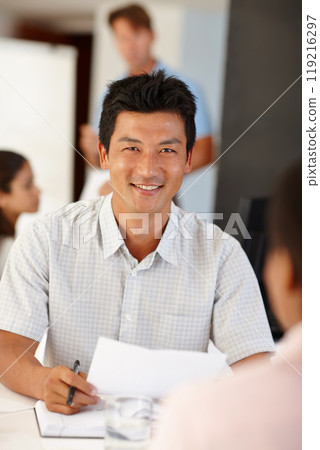 Documents, Asian man or business people in meeting for report, agenda discussion or portfolio for project. Smile, teamwork or workers planning in office talking, conversation or speaking of paperwork Documents, Asian man or business people in meeting for report, agenda discussion or portfolio for project. Smile, teamwork or workers planning in office talking, conversation or speaking of paperwork 119216297