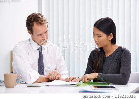 Business people, teamwork and meeting with documents in office for financial feedback and corporate strategy. Man, woman and collaboration with communication, paperwork and planning with discussion 119216326