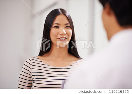 Business, cooperation and woman in conversation at office with feedback on project collaboration. Japanese, employee and question for businessman with discussion of ideas, development or teamwork 119216335