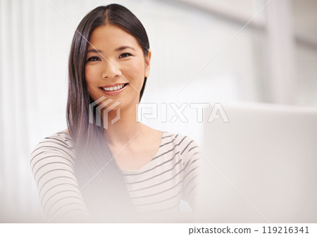 Smile, employee and portrait of woman with laptop on table working with internet online. Adult, Asian female person and staff in corporate company to research on website and social media for business 119216341