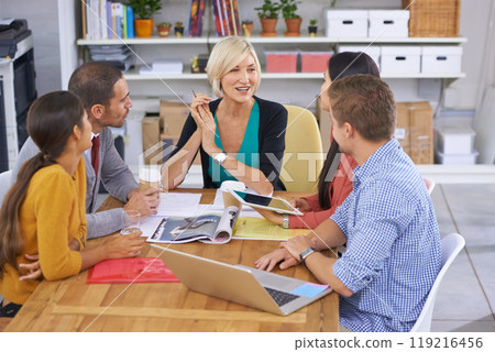 Senior woman, leadership and meeting in office for planning, collaboration and strategy in startup company. Happy manager, laptop and diverse group of people for discussion, idea or teamwork Senior woman, leadership and meeting in office for planning, collaboration and strategy in startup company. Happy manager, laptop and diverse group of people for discussion, idea or teamwork 119216456