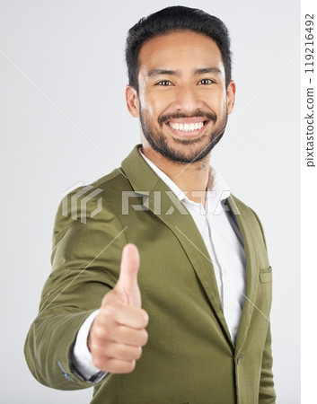 Happy asian man, portrait and thumbs up in winning, success or thank you against a white studio background. Businessman smile with like emoji, yes sign or OK in agreement, good job or approval Happy asian man, portrait and thumbs up in winning, success or thank you against a white studio background. Businessman smile with like emoji, yes sign or OK in agreement, good job or approval 119216492