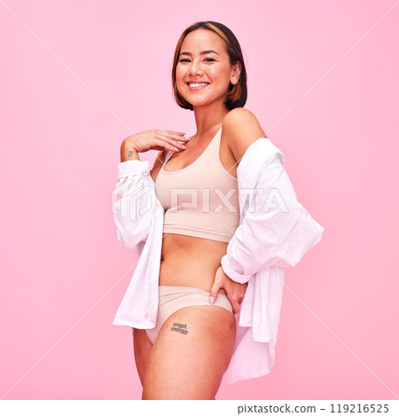 Asian woman, underwear and smile in studio portrait, shirt and beauty with healthy body by pink background. Japanese fashion model, girl and lingerie with confidence, body positive and cosmetics Asian woman, underwear and smile in studio portrait, shirt and beauty with healthy body by pink background. Japanese fashion model, girl and lingerie with confidence, body positive and cosmetics 119216525