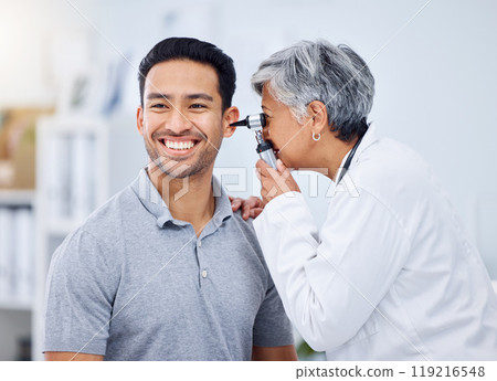 Doctor, patient or ear check for healthcare or wellness at hospital with otolaryngology specialist. Man, smile or senior physician woman with otoscope test for hearing problem or medical consultation 119216548