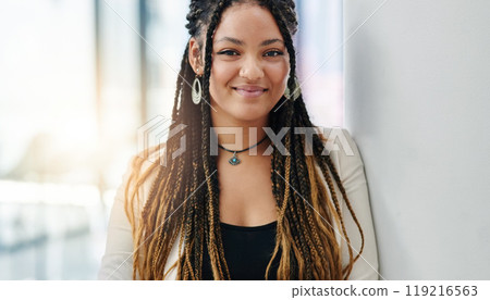 Doing business with grace and poise. Cropped portrait of an attractive young female designer standing in her office. 119216563