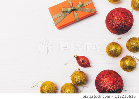A white background with a red box and a bunch of gold and red ornaments 119216636