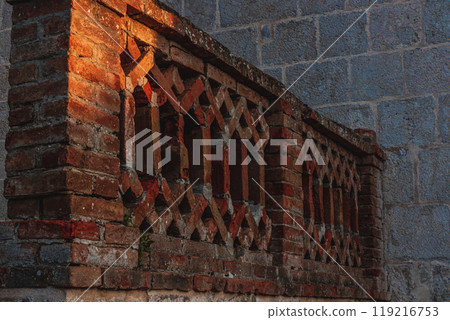 Krk Croatia 28.06.24Old restored brick fence near the church 119216753