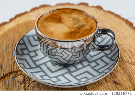 espresso cup on a wooden stand made of real oak 119216771